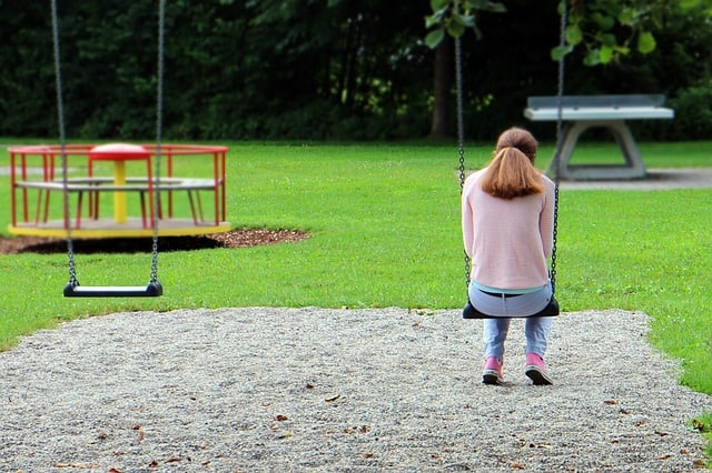 sad woman in a playground